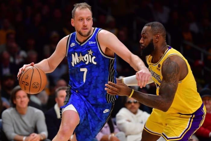 Orlando Magic forward Joe Ingles (7) and Los Angeles Lakers forward LeBron James (23).